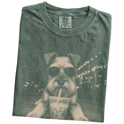 Folded Moss Comfort Colors® T-shirt showing Schnauzer with iced coffee in a retro grunge design