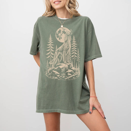 Model wearing a Moss Comfort Colors® T-shirt with a Irish Setter howling beneath the moon and pine trees