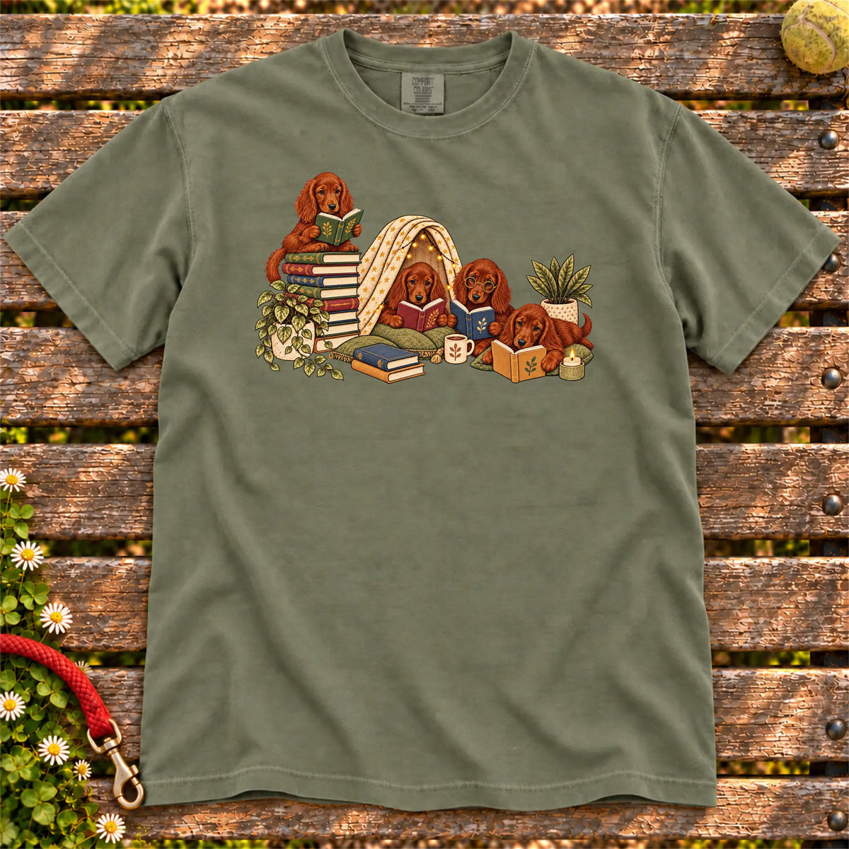 Irish Setter puppies reading books in a cozy blanket fort on a Moss T-shirt