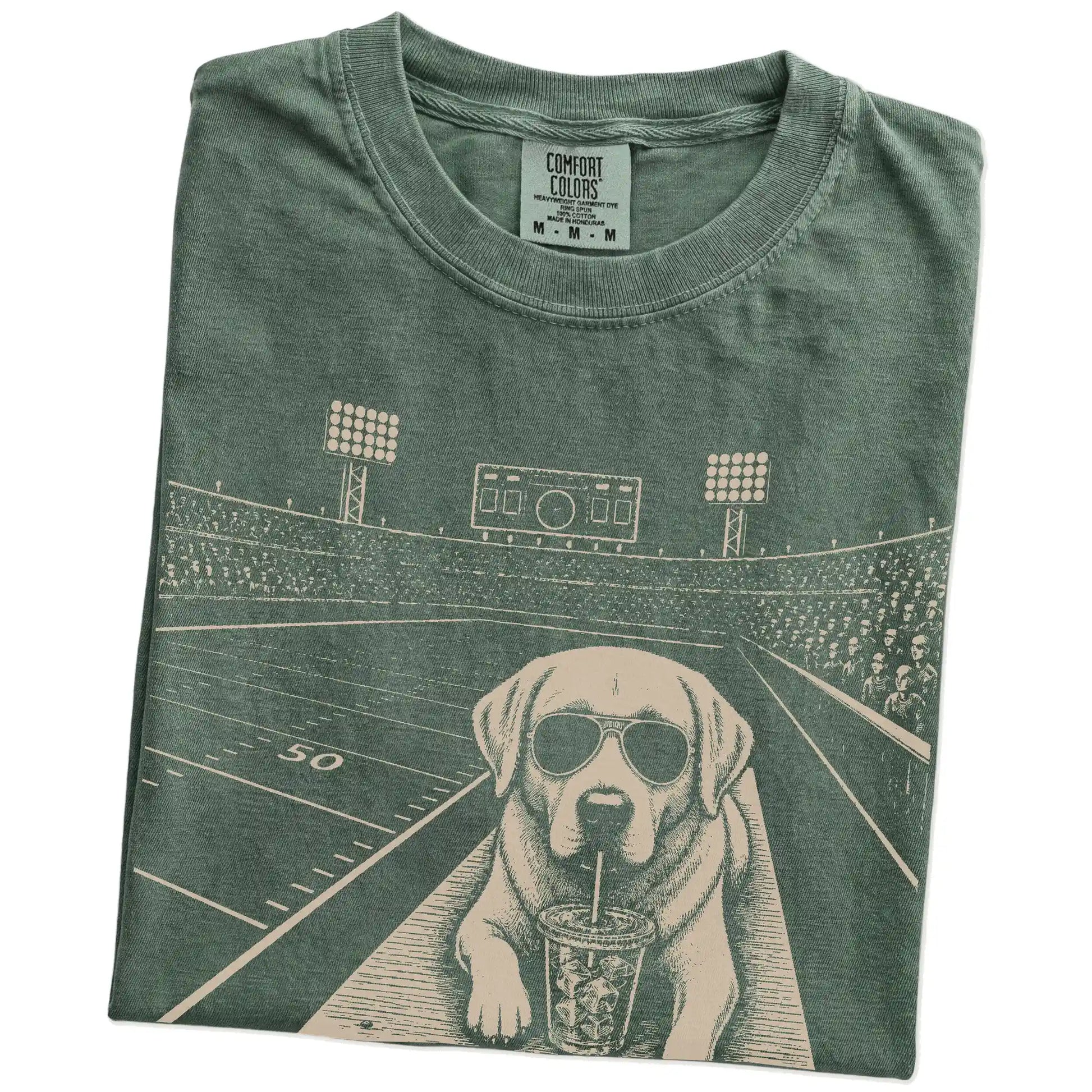 Folded Moss Comfort Colors® T-shirt showing Labrador Retriever ready for football and tailgate season