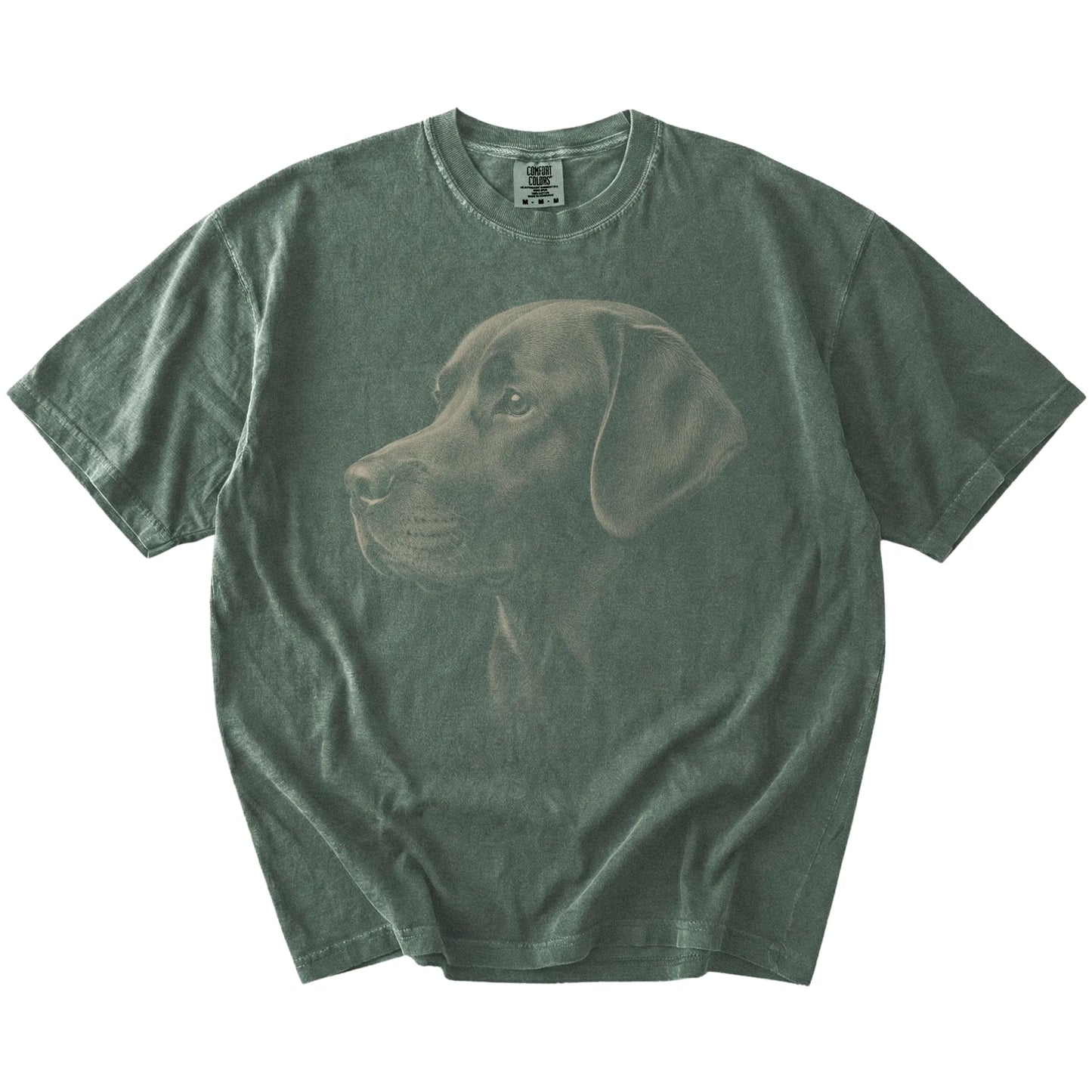 A detailed photographic portrait of a Labrador Retriever on a Moss Comfort Colors® T-shirt