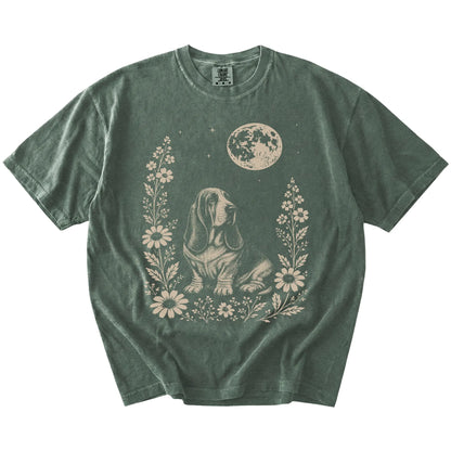Basset Hound framed by flowers beneath the moon on a Moss Comfort Colors® T-shirt