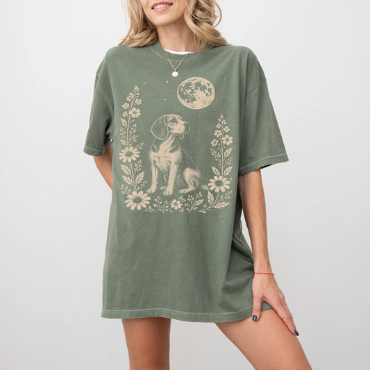 Model wearing a Moss Comfort Colors® T-shirt featuring Beagle framed by flowers beneath the moon