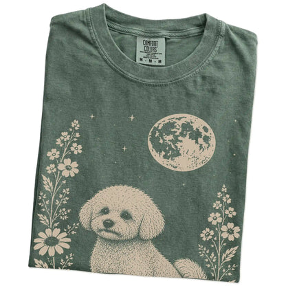 Folded Moss Comfort Colors® T-shirt showing Bichon Frise framed by flowers beneath the moon