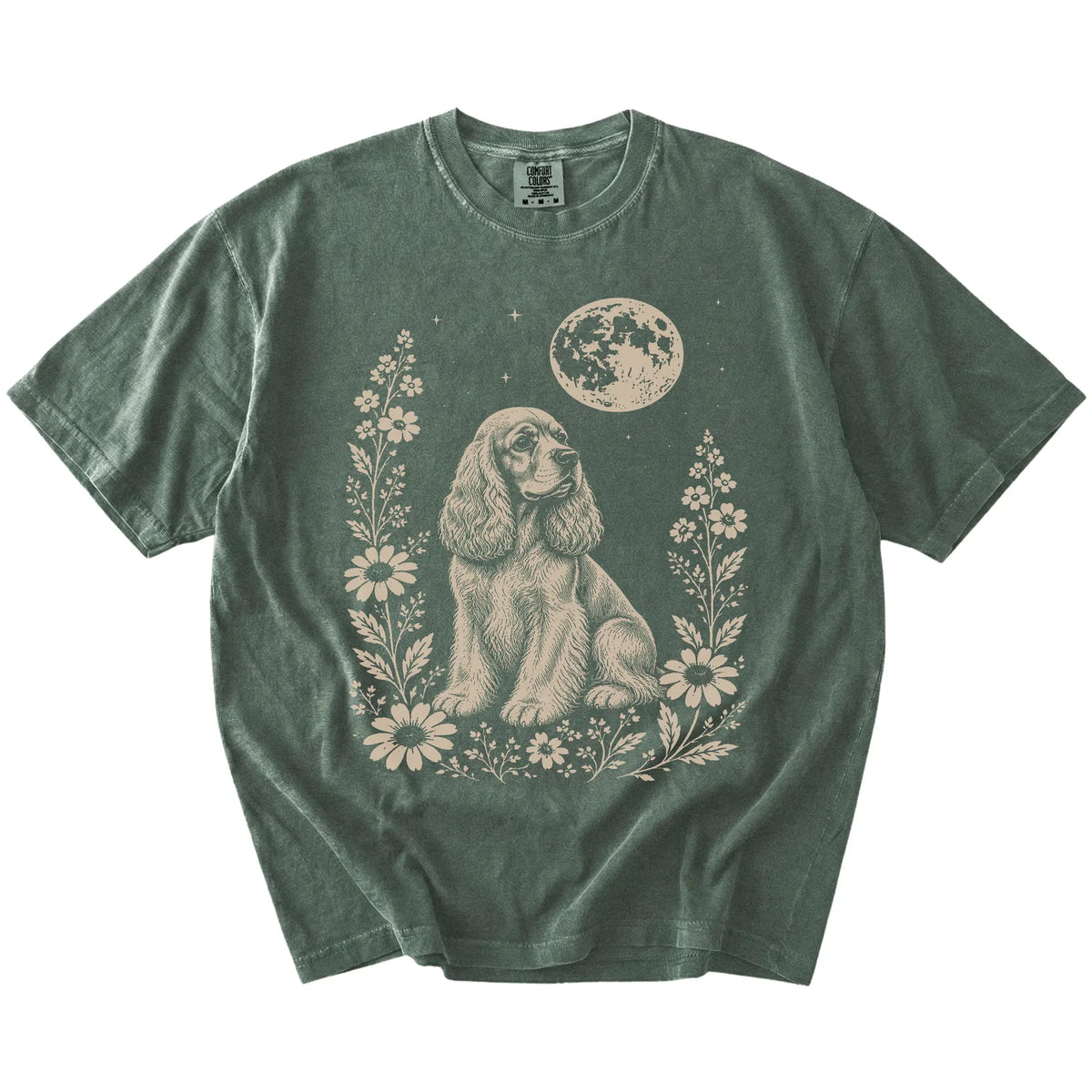 Cocker Spaniel framed by flowers beneath the moon on a Moss Comfort Colors® T-shirt