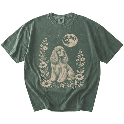 Cocker Spaniel framed by flowers beneath the moon on a Moss Comfort Colors® T-shirt