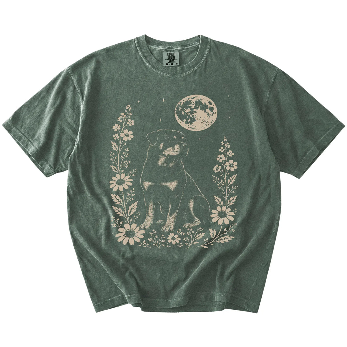 Rottweiler framed by flowers beneath the moon on a Moss Comfort Colors® T-shirt