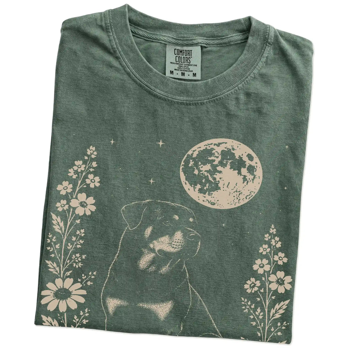 Folded Moss Comfort Colors® T-shirt showing Rottweiler framed by flowers beneath the moon