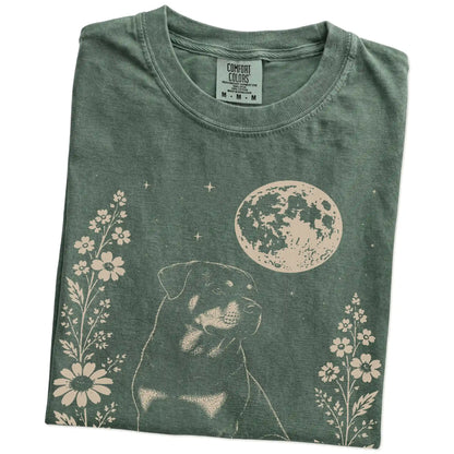 Folded Moss Comfort Colors® T-shirt showing Rottweiler framed by flowers beneath the moon