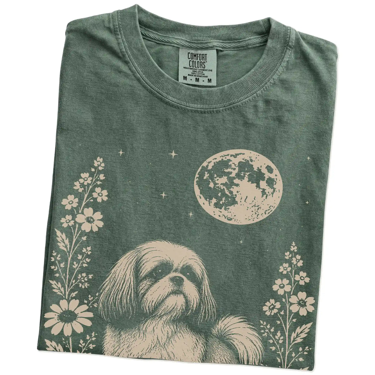 Folded Moss Comfort Colors® T-shirt showing Shih Tzu framed by flowers beneath the moon