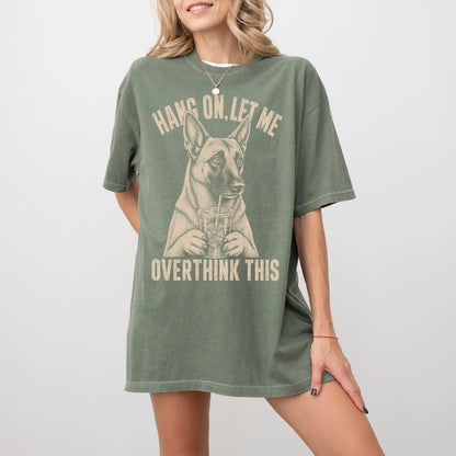 Woman wearing a Moss Overthinking Belgian Malinois T-Shirt