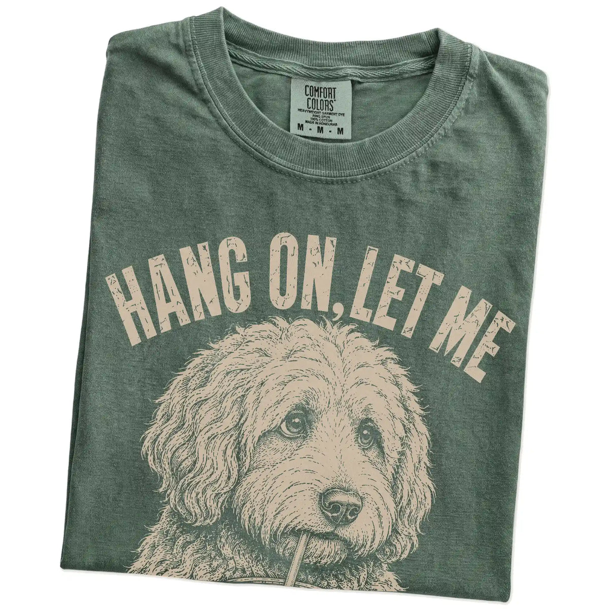 Folded Moss Overthinking Goldendoodle T-Shirt showing the graphic