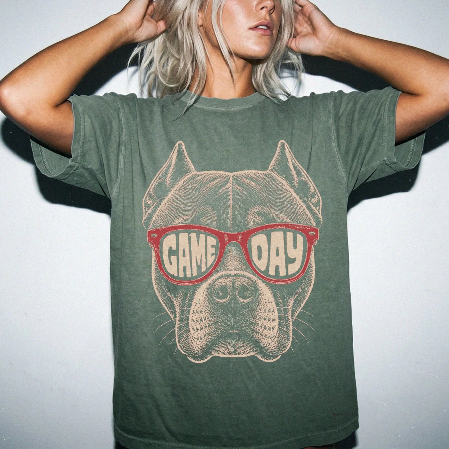 Model wearing a Moss Comfort Colors® T-shirt with pitbull wearing red game day sunglasses