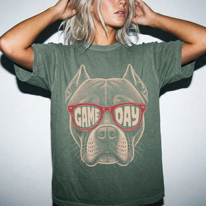 Model wearing a Moss Comfort Colors® T-shirt with pitbull wearing red game day sunglasses