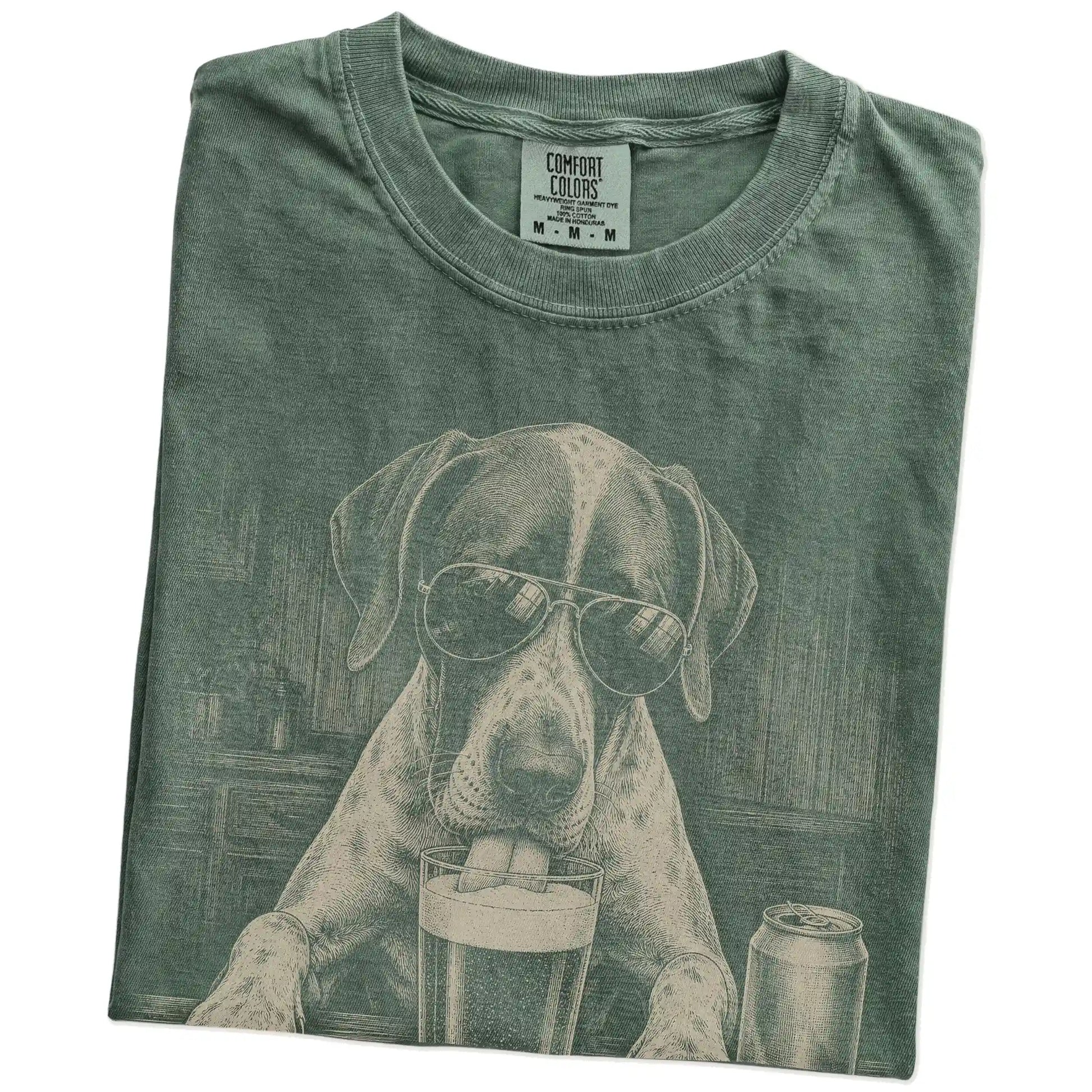 Folded Moss Comfort Colors® t-shirt showing Pointer sneaking a drink from a pint