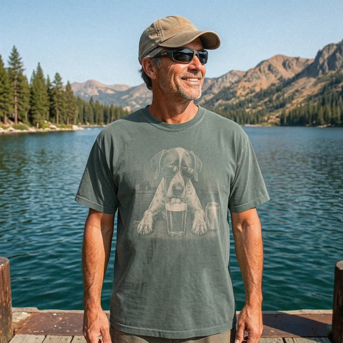 Model wearing a Moss Comfort Colors® t-shirt with Pointer sneaking a drink from a pint