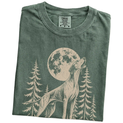 Folded Moss Comfort Colors® T-shirt showing a Pointer howling beneath the moon and pine trees