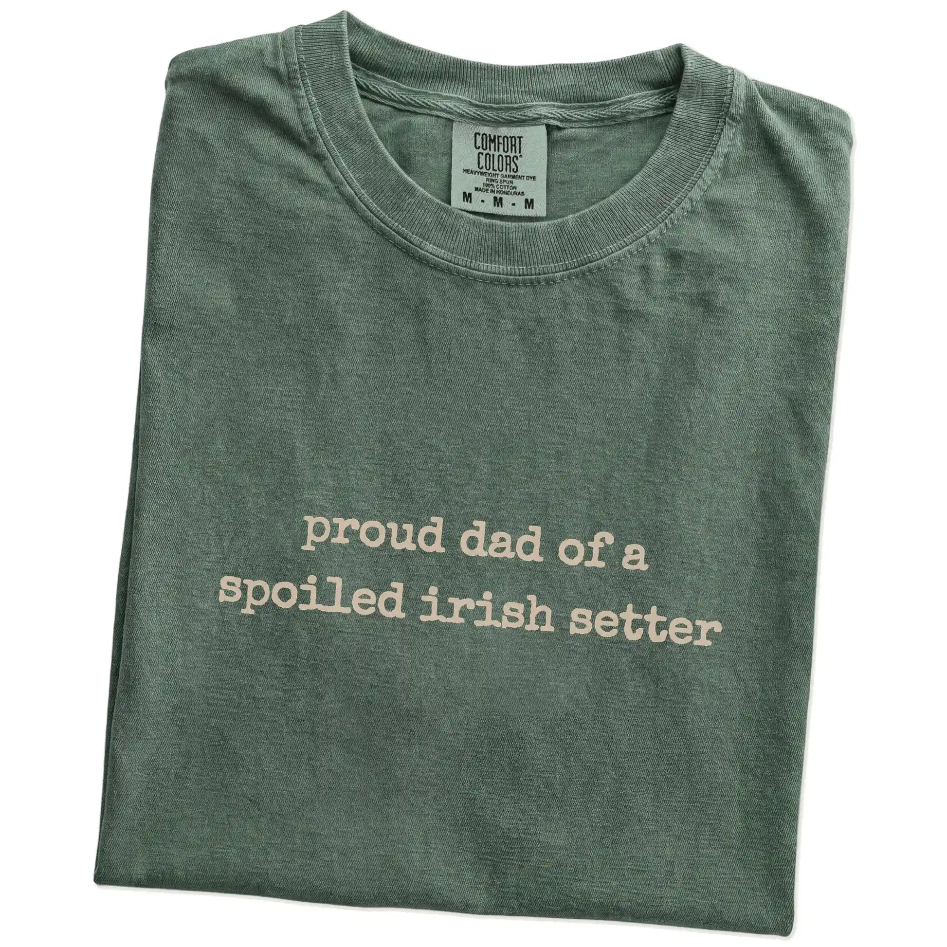 Folded Moss Comfort Colors® T-shirt showing proud dad of a spoiled irish setter lettering