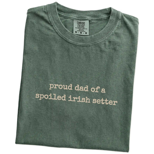 Folded Moss Comfort Colors® T-shirt showing proud dad of a spoiled irish setter lettering