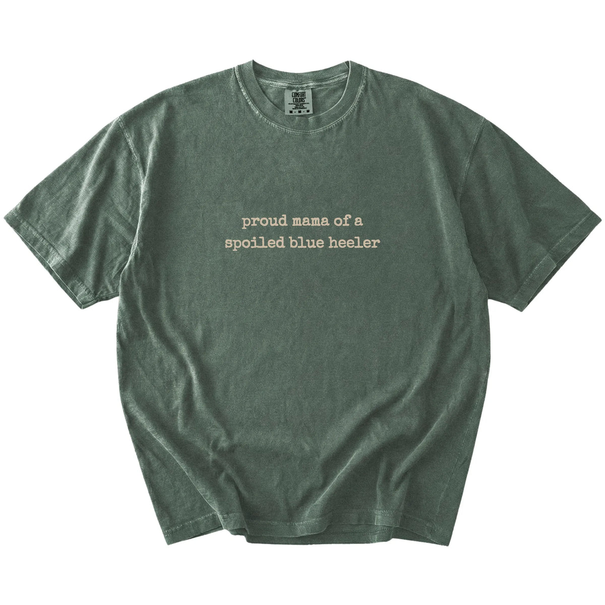 Proud Mama of a Spoiled Blue Heeler lettering on a Moss Comfort Colors® T-shirt