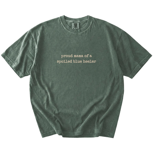Proud Mama of a Spoiled Blue Heeler lettering on a Moss Comfort Colors® T-shirt