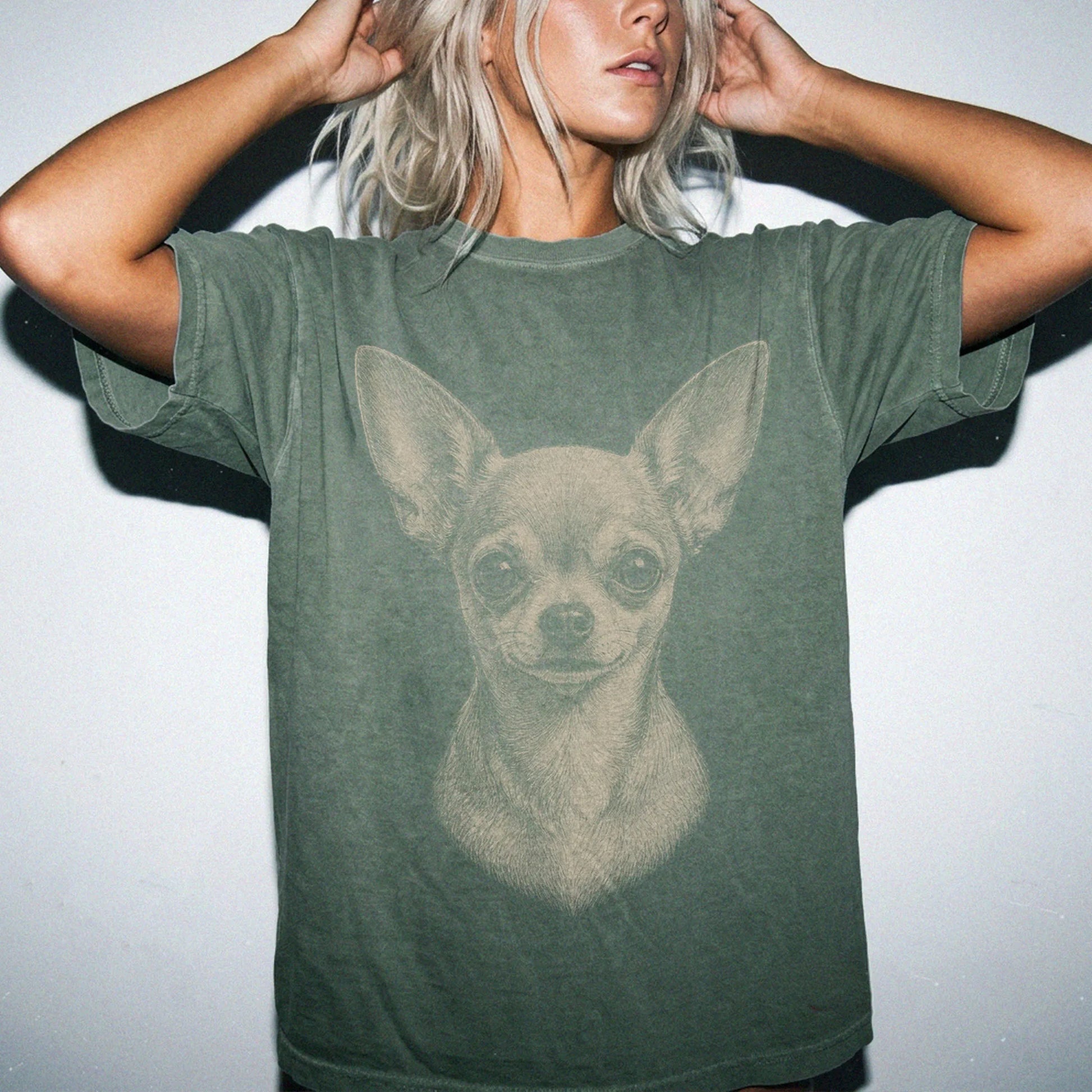 Model wearing a Moss Comfort Colors® T-shirt with a realistic drawing of a Chihuahua