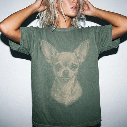 Model wearing a Moss Comfort Colors® T-shirt with a realistic drawing of a Chihuahua