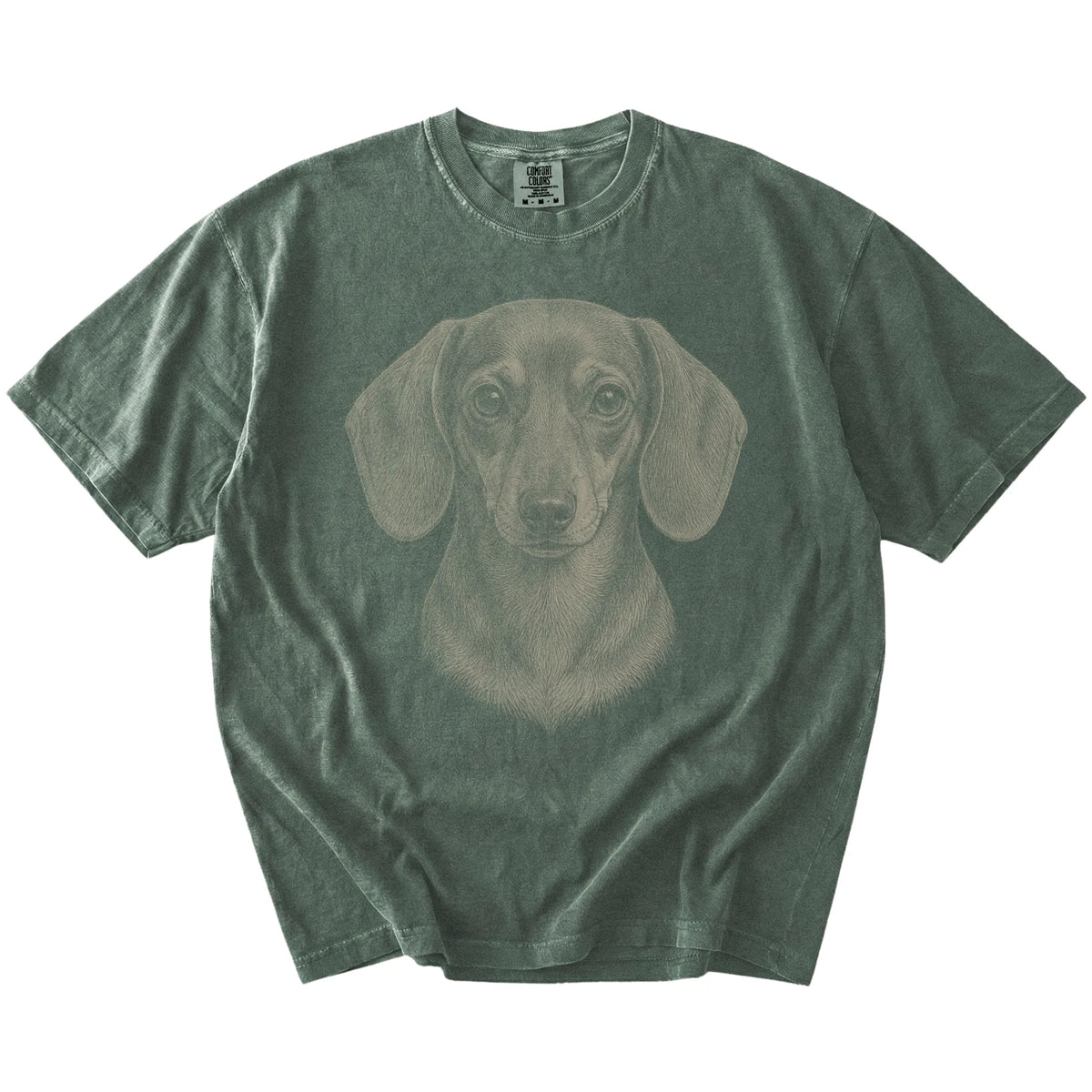 A realistic drawing of a Dachshund on a Moss Comfort Colors® T-shirt