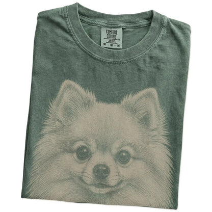Folded Moss Comfort Colors® T-shirt showing a realistic drawing of a Pomeranian