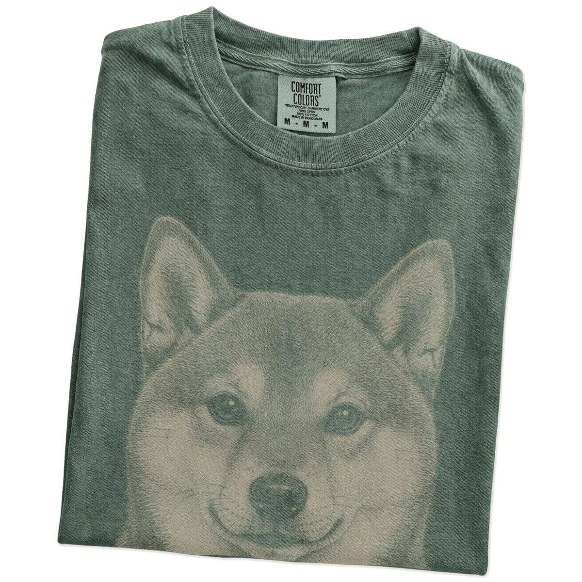 Folded Moss Comfort Colors® T-shirt showing a realistic drawing of a Shiba Inu