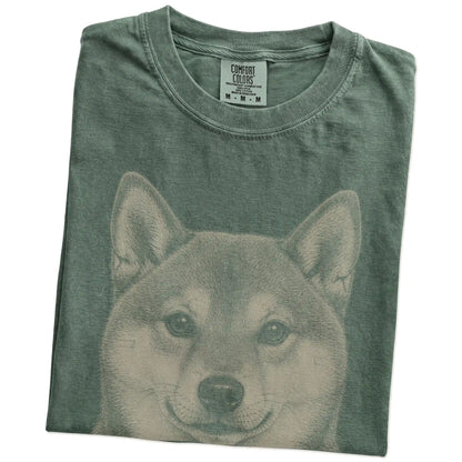 Folded Moss Comfort Colors® T-shirt showing a realistic drawing of a Shiba Inu