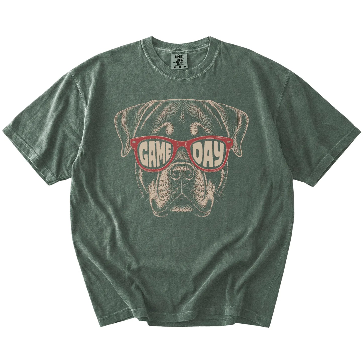 Rottweiler wearing red Game Day sunglasses on a Moss Comfort Colors® T-shirt