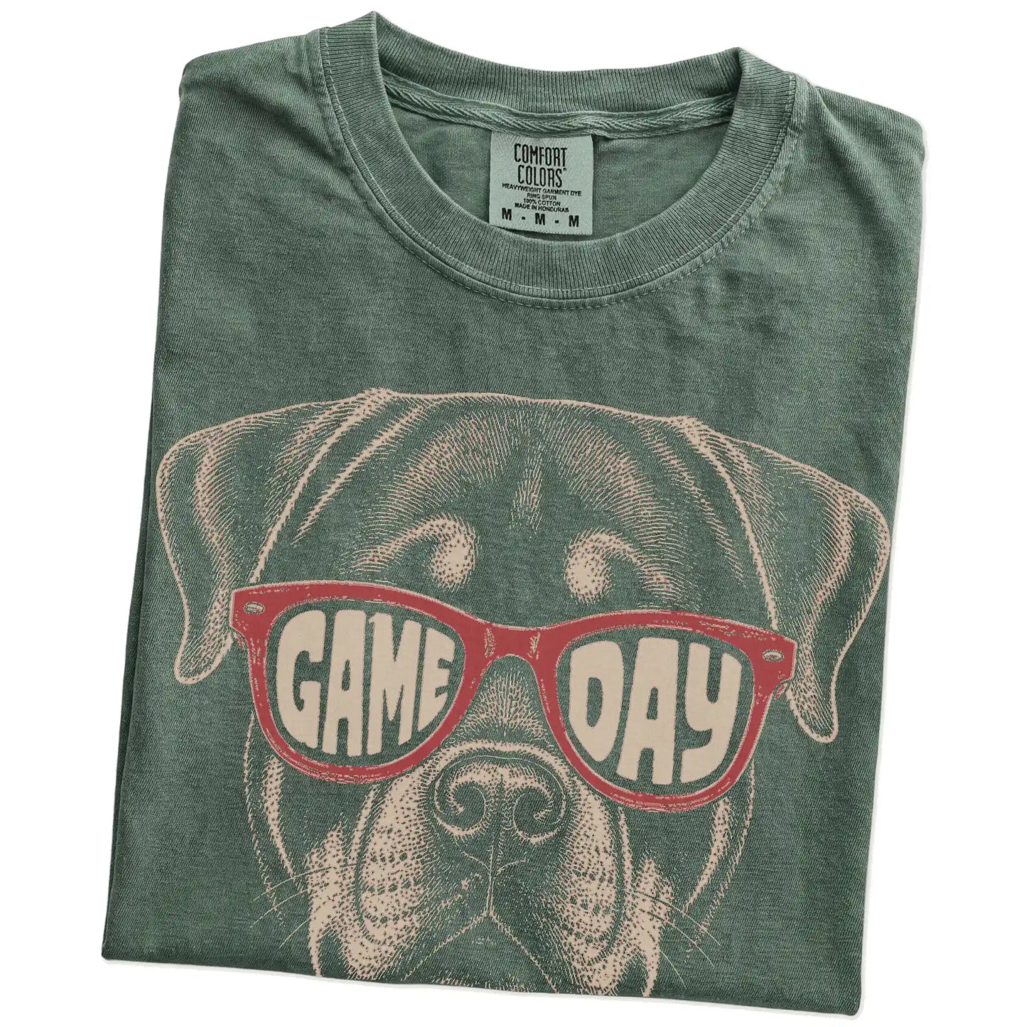 Folded Moss Comfort Colors® T-shirt showing rottweiler wearing red game day sunglasses