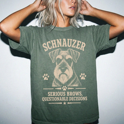 Model wearing a Moss Comfort Colors® T-shirt featuring Schnauzer design with “Serious Brows, Questionable Decisions” letterin