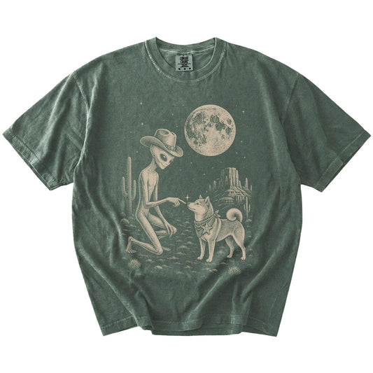 Cowboy alien fist-bumping a Shiba Inu beneath the moon on a Moss Comfort Colors® T-shirt