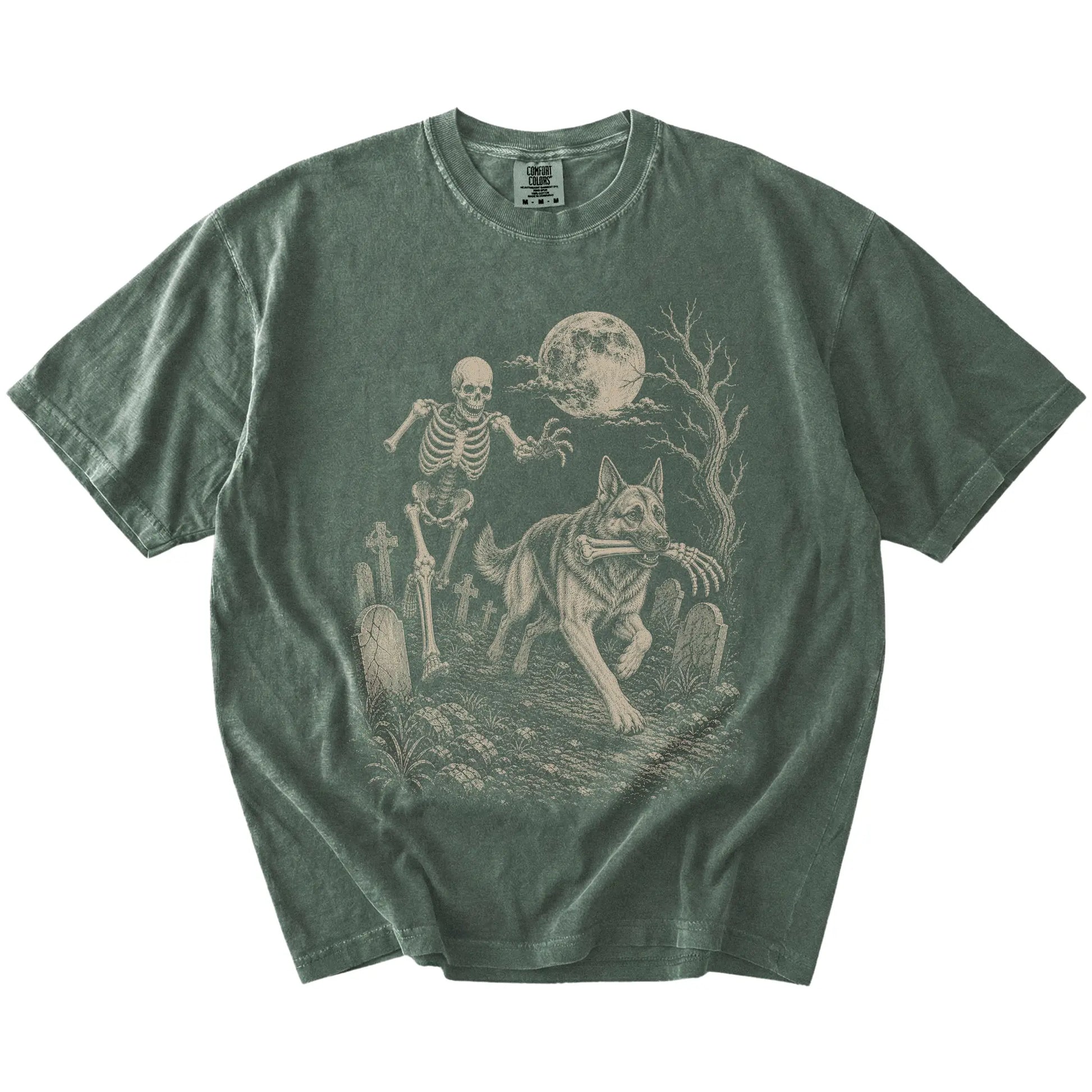 German Shepherd running from a skeleton on a Moss Comfort Colors® T-shirt