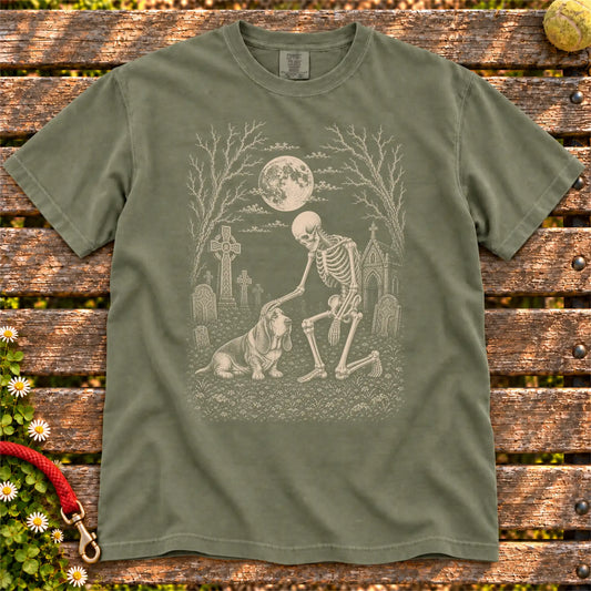 Basset Hound sharing a quiet cemetery moment with a friendly skeleton on a Moss Comfort Colors® T-shirt