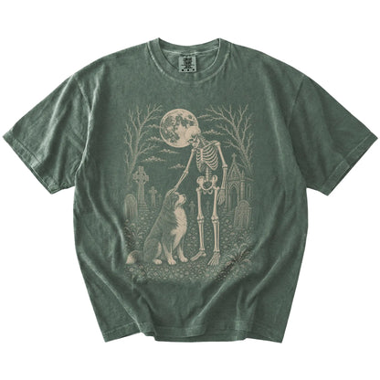 Bernese Mountain Dog sharing a quiet cemetery moment with a friendly skeleton on a Moss Comfort Colors® T-shirt