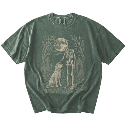 Labrador Retriever sharing a quiet cemetery moment with a friendly skeleton on a Moss Comfort Colors® T-shirt