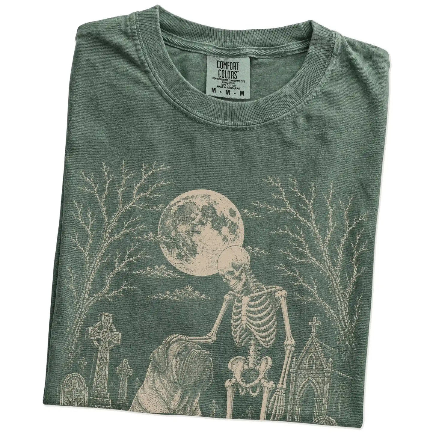 Folded Moss Comfort Colors® T-shirt showing Mastiff sharing a quiet cemetery moment with a friendly skeleton