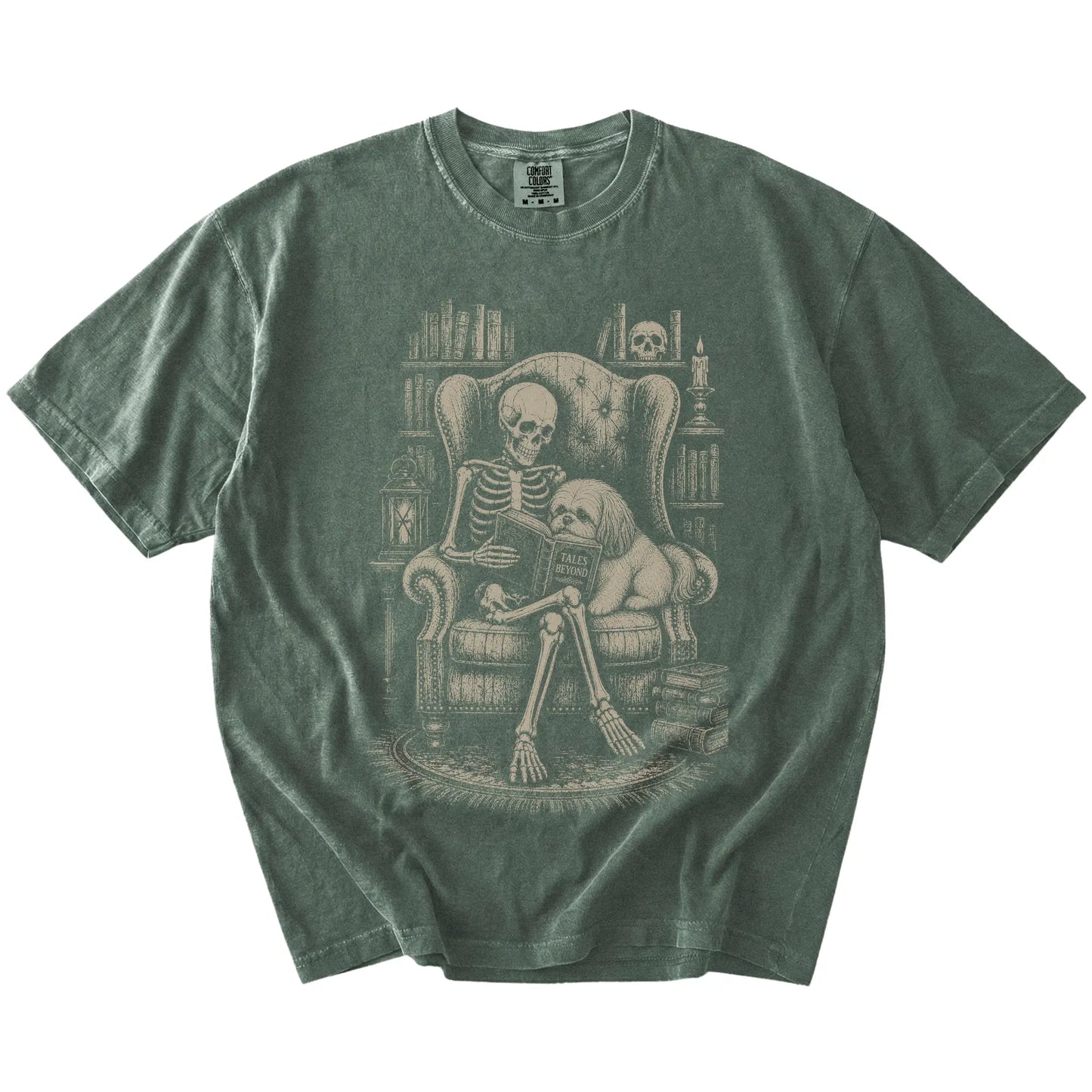 Skeleton reading in a library beside a Shih Tzu on a Moss Comfort Colors® T-shirt