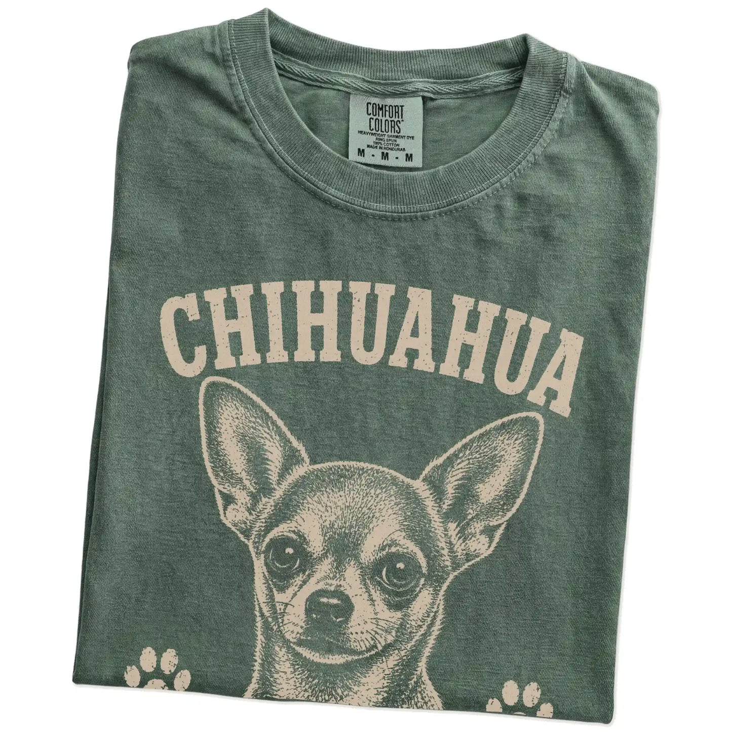 Folded Moss Comfort Colors® T-shirt showing Chihuahua design with “Small Package, Loud Opinions” lettering