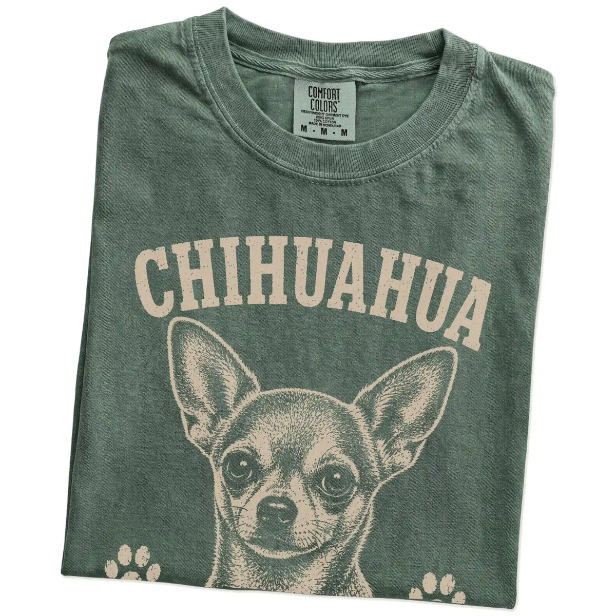 Folded Moss Comfort Colors® T-shirt showing Chihuahua design with “Small Package, Loud Opinions” lettering