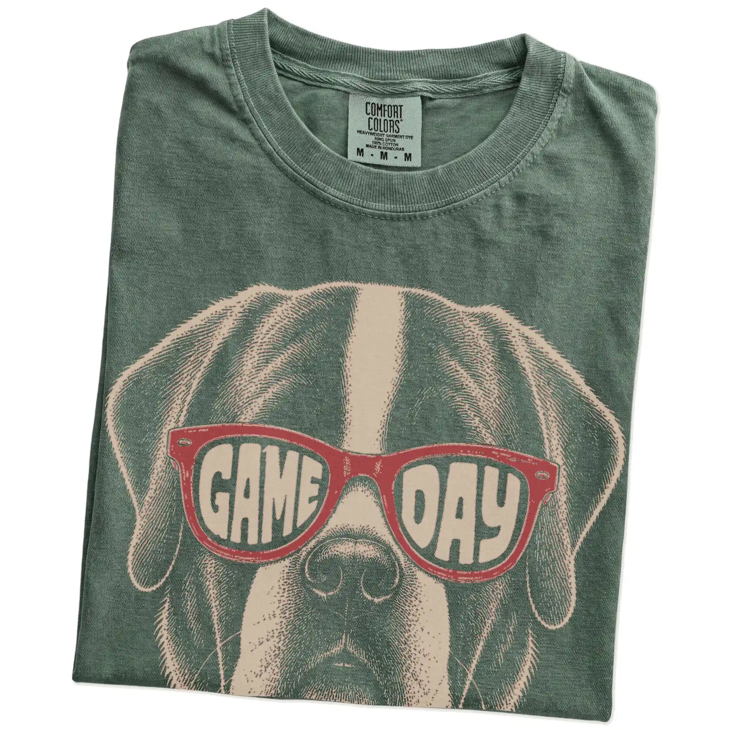 Folded Moss Comfort Colors® T-shirt showing saint bernard wearing red game day sunglasses