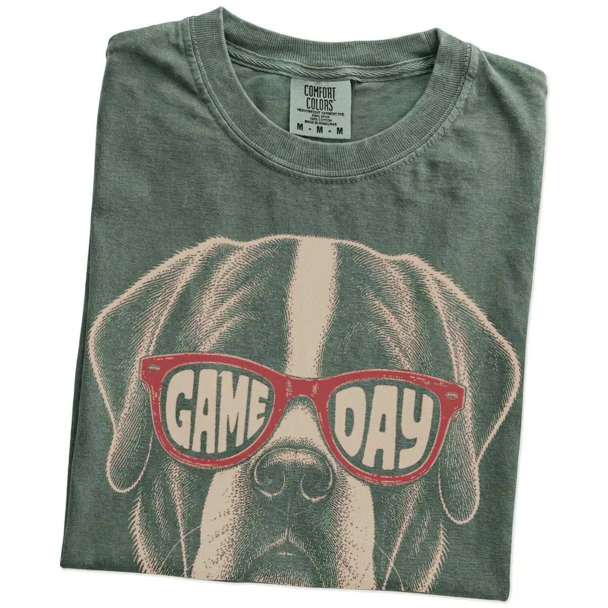Folded Moss Comfort Colors® T-shirt showing saint bernard wearing red game day sunglasses