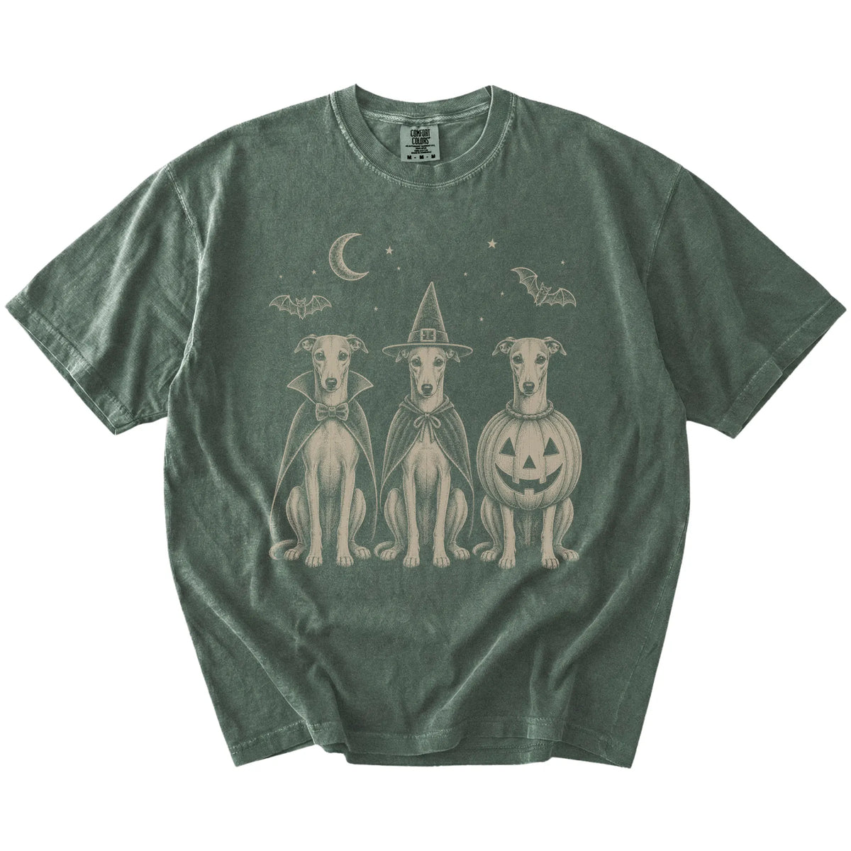 Three Whippet dogs dressed for Halloween beneath bats and a crescent moon on a Moss Comfort Colors® T-shirt