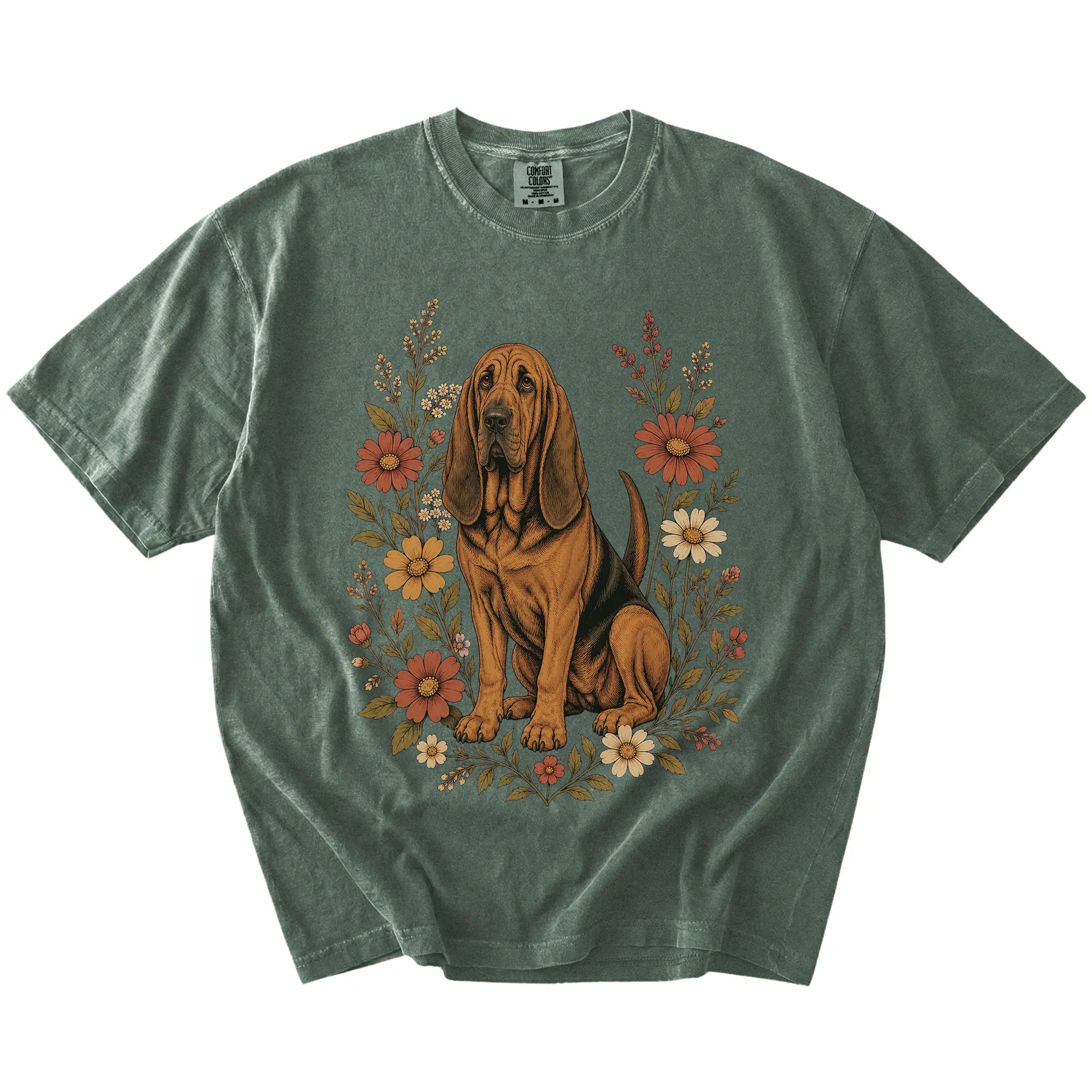 Bloodhound portrait surrounded by wildflowers beneath the moon on a Moss Comfort Colors® T-shirt