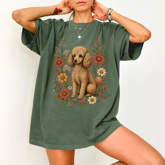 Model wearing a Moss Comfort Colors® T-shirt showing Poodle portrait surrounded by wildflowers beneath the moon