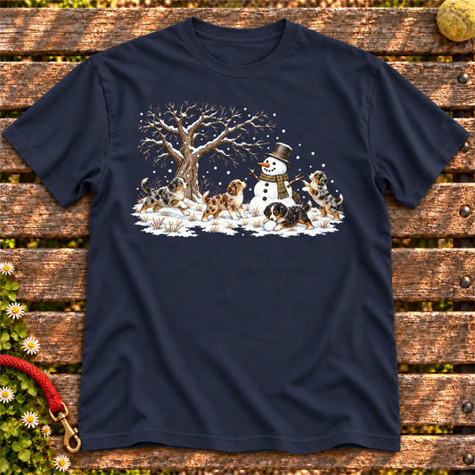 Australian Shepherd puppies playing in snow with a snowman on a Navy T-shirt