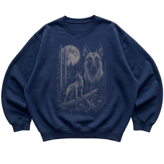 Belgian Malinois Moonlit Forest graphic on a navy crewneck sweatshirt laid flat